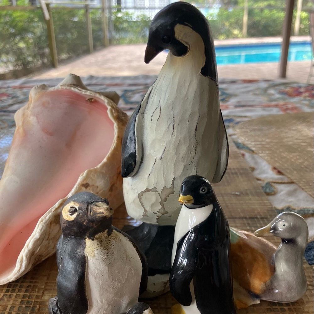 THREE PENGUINS AND A DUCK